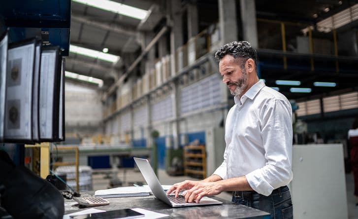 Loadsure man working on laptop
